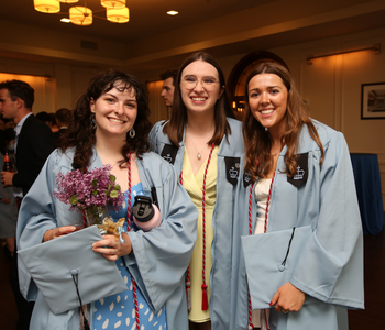 Three Trinity-Columbia Dual BA Students in graduation robes