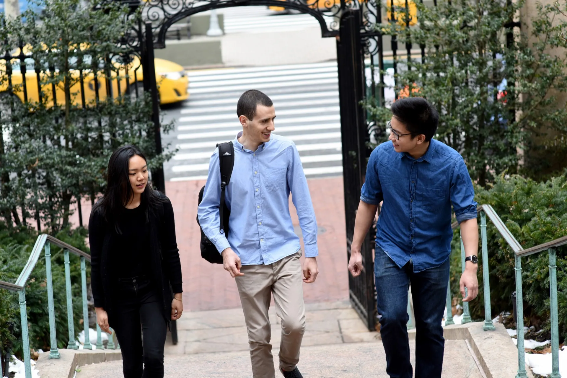 Columbia students walking up Earl Hall stairs